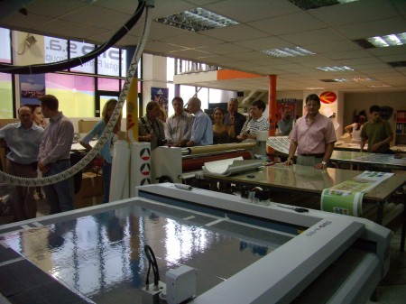 Members of GIGA sit around a table discussing processes and techniques